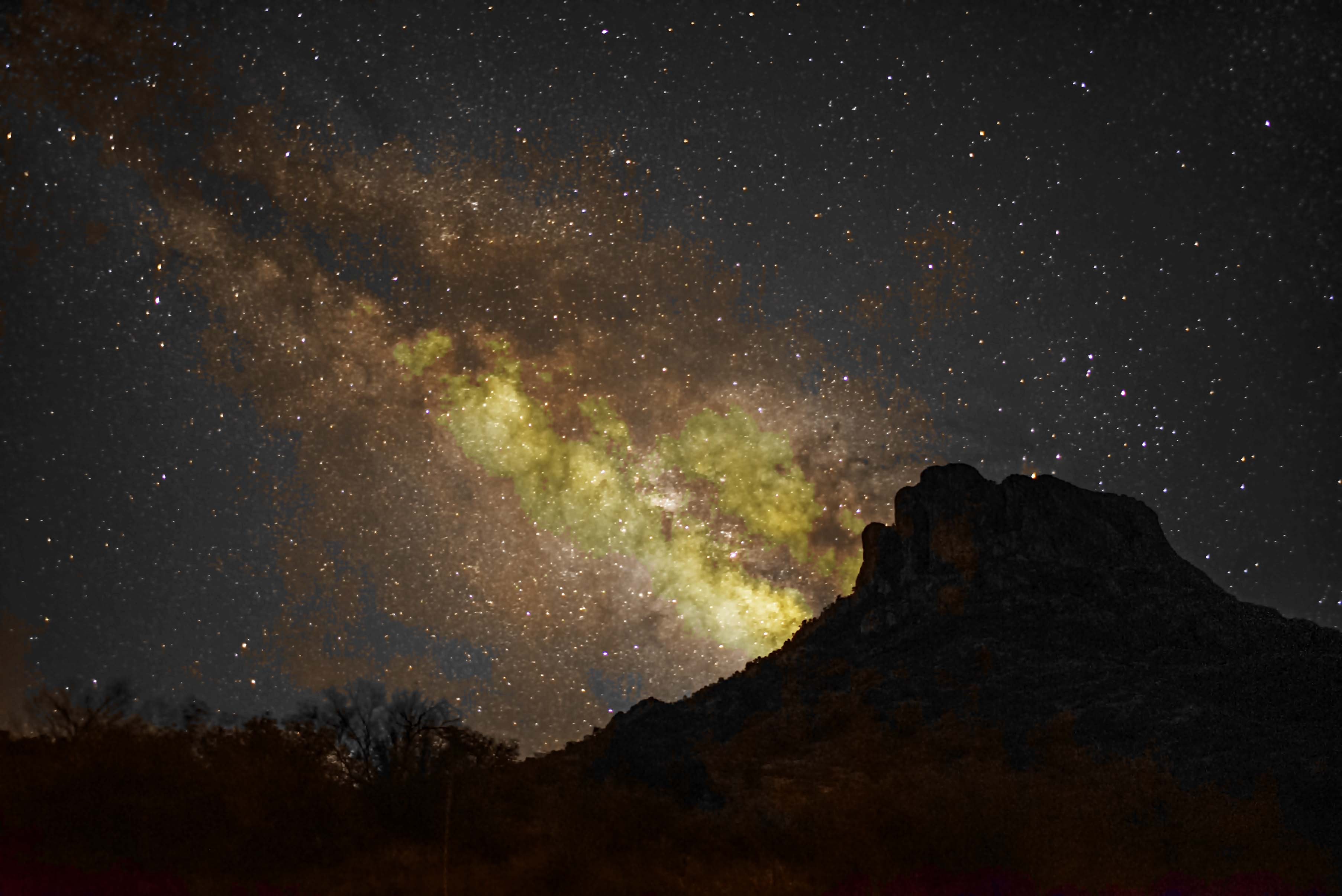 Milky Way rising above the silhouetted Chisos Mountains in Big Bend
