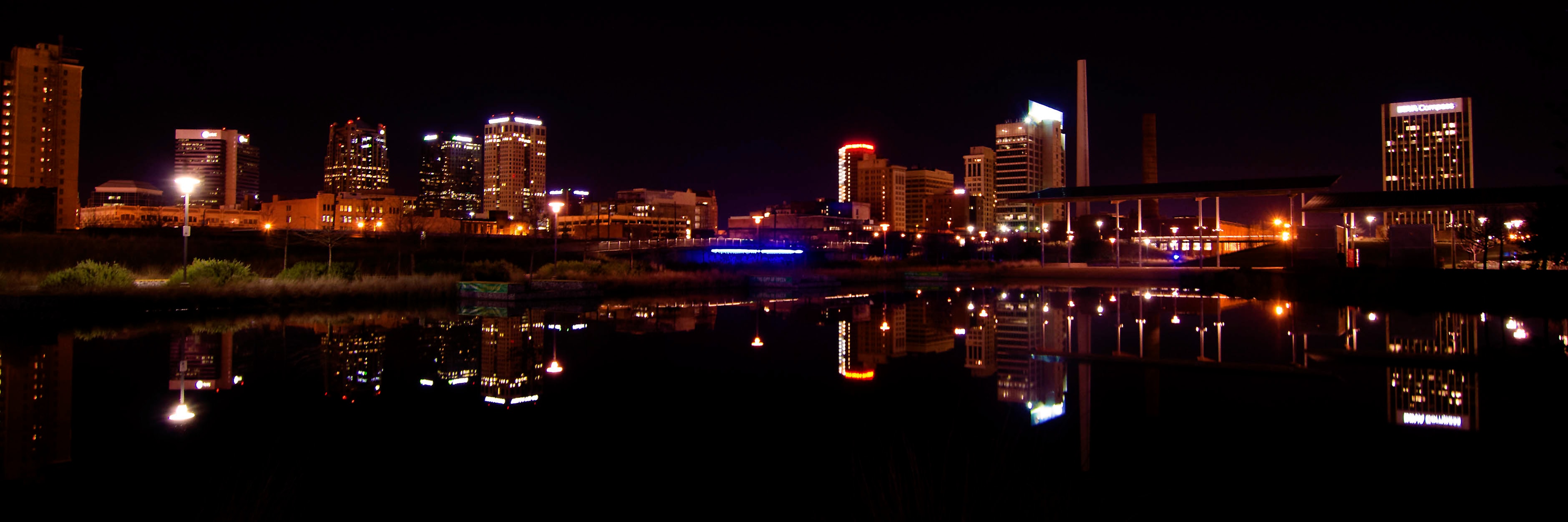 Birmingham skyline reflected in still water at night