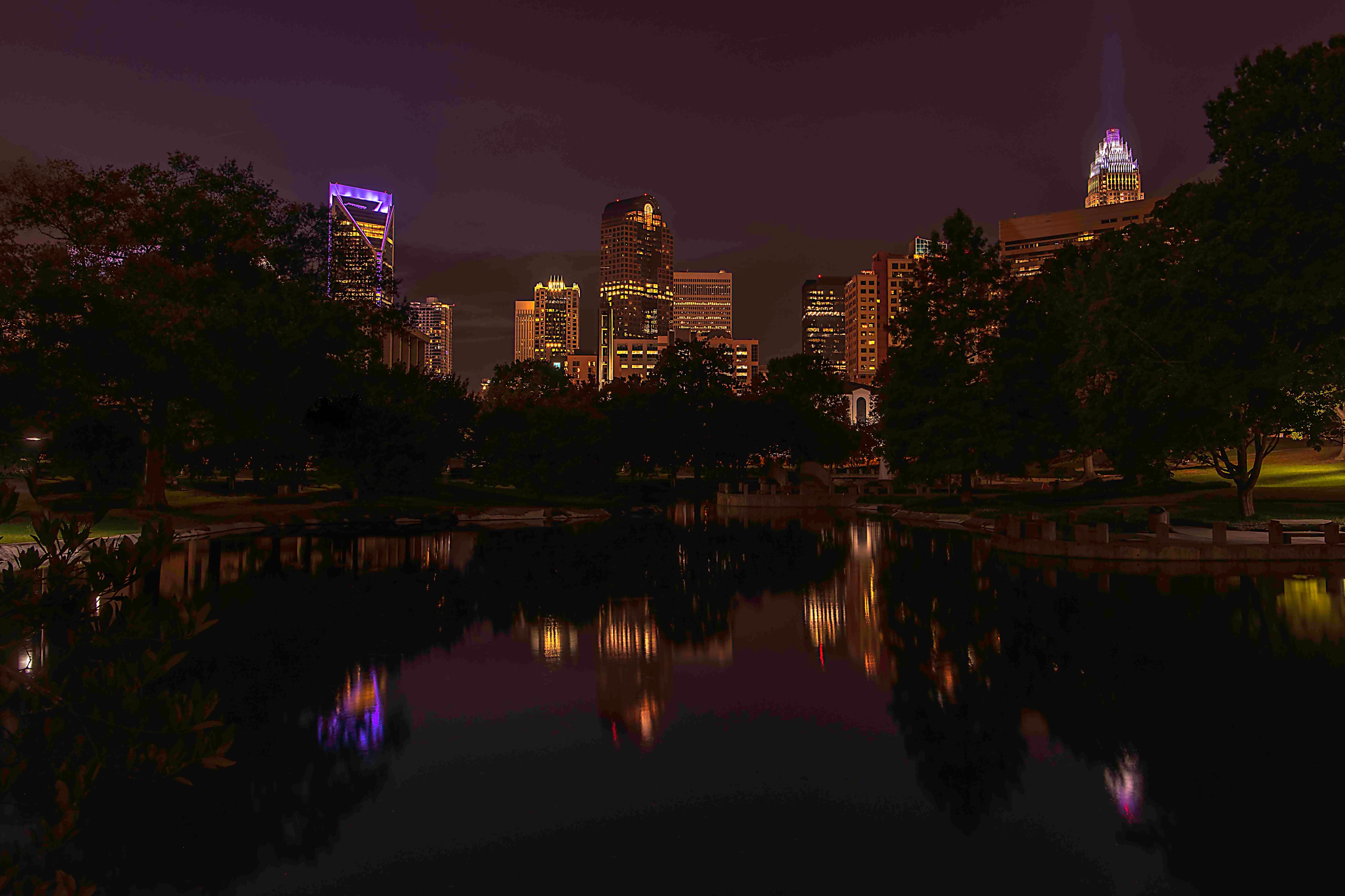 Charlotte skyline reflected in a park pond at night